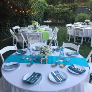 evening outdoor dinner event round tables